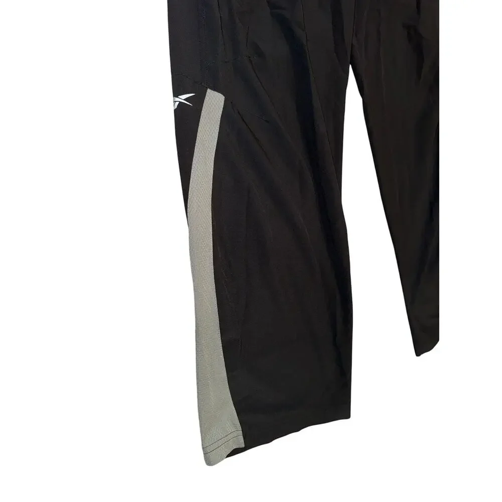 Vintage Reebok Y2K black wind pants men’s medium elastic waist retro athletic